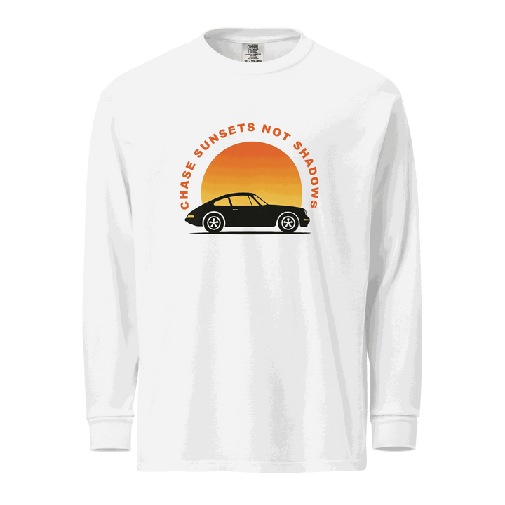 White garment-dyed long sleeve shirt with vintage car and sunset graphic and "Chase Sunsets Not Shadows" text
