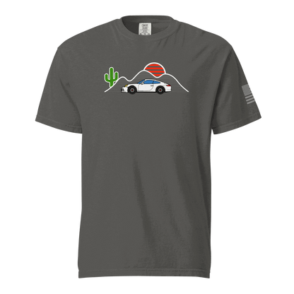 Sunset Sports Car T-Shirt with white sports car, red sun, mountains, and cactus graphic on charcoal gray fabric