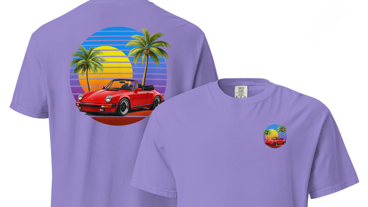 Purple t-shirt with a red convertible car and palm tree design on a white background