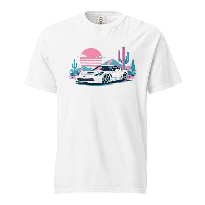 A white short-sleeve crewneck t-shirt featuring a colorful graphic print of a white sports car in a desert landscape with pink sunsets, blue mountains, and green cacti.