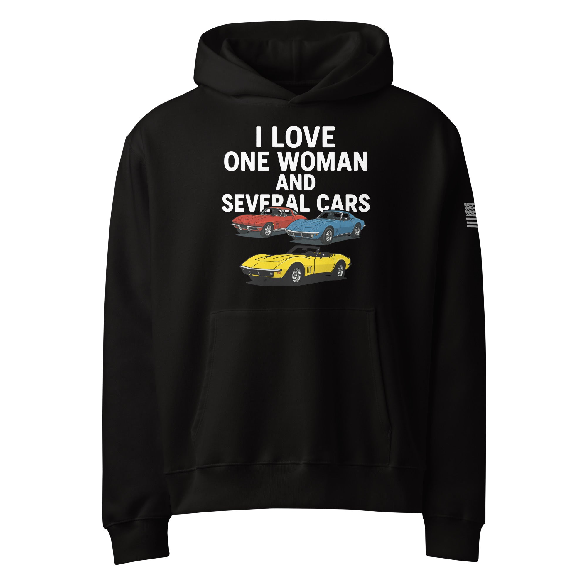 oversized heavyweight hoodie with ‘One Woman Several Cars’ text printed on the front — features a soft brushed fleece interior, double-layered hood without drawcords, front kangaroo pocket, and a roomy unisex fit — displayed in multiple color options.”