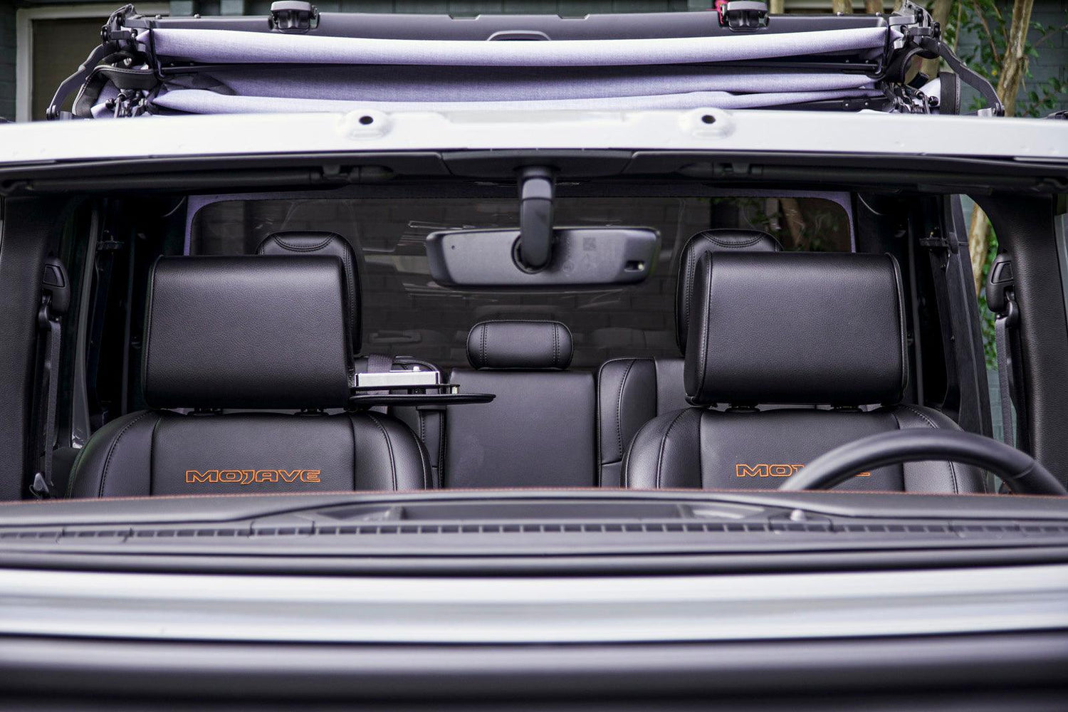 The Vulcan Headrest Safe secured on a truck seat with biometric lock and steel construction