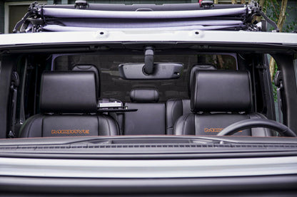 The Vulcan Headrest Safe secured on a truck seat with biometric lock and steel construction