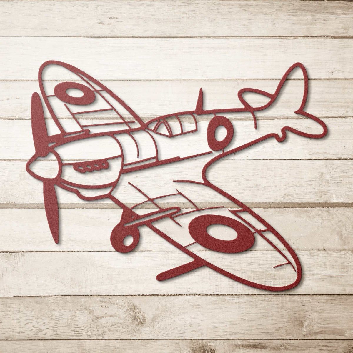 Spitfire WWII Fighter metal wall art in garage aviation decor