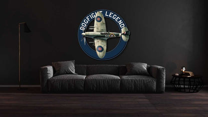 Multicolor metal sign featuring Spitfire dogfight aircraft on a dark wall above a gray sofa in a modern living room